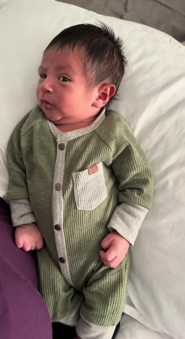 Baby giving side eye green screen
