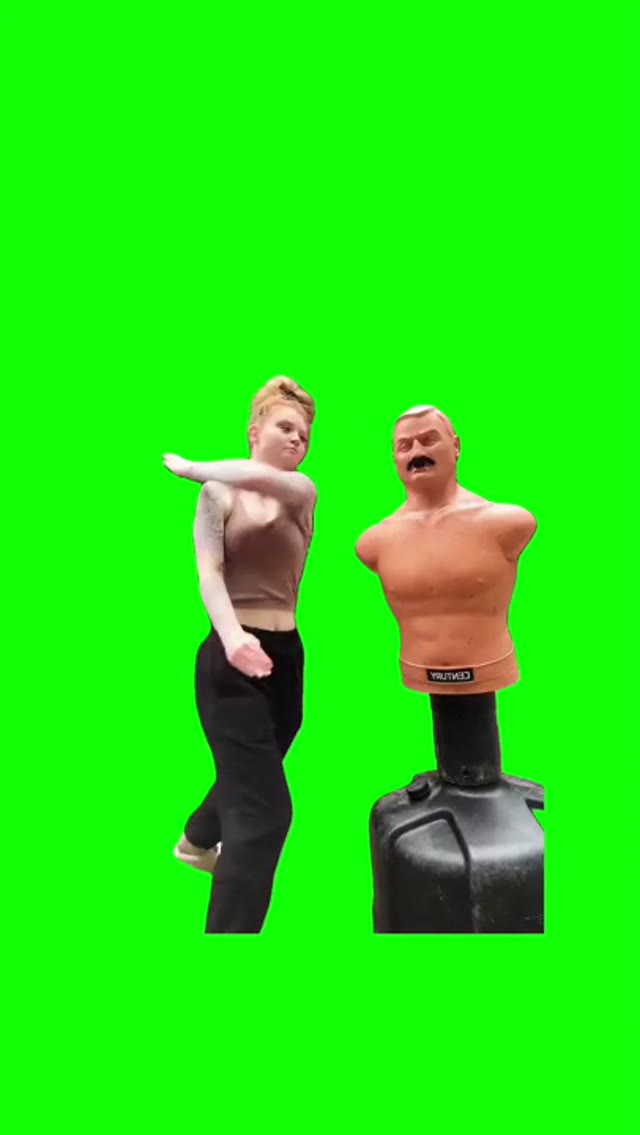 Girl punches a dummy  green screen
