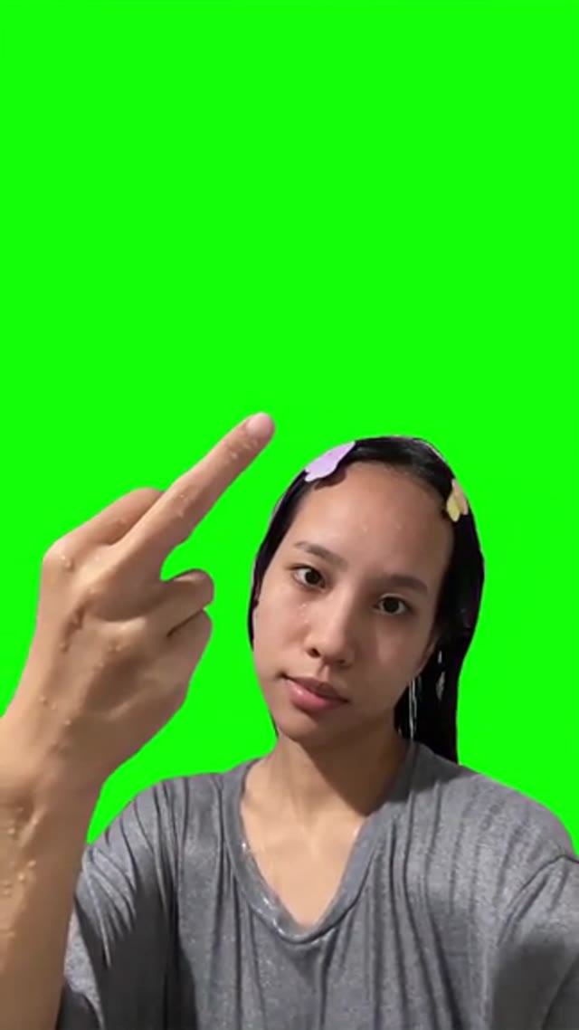 Girl throwing middle finger in the air  green screen