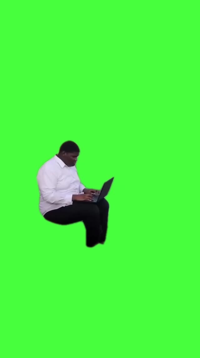 Man working on laptop green screen