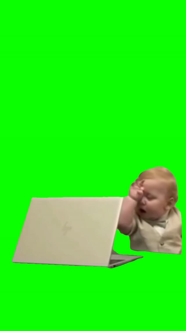 Tired baby on laptop green screen