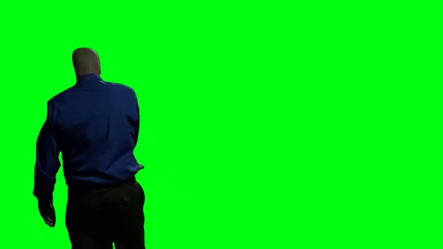 Walter White sitting down green screen